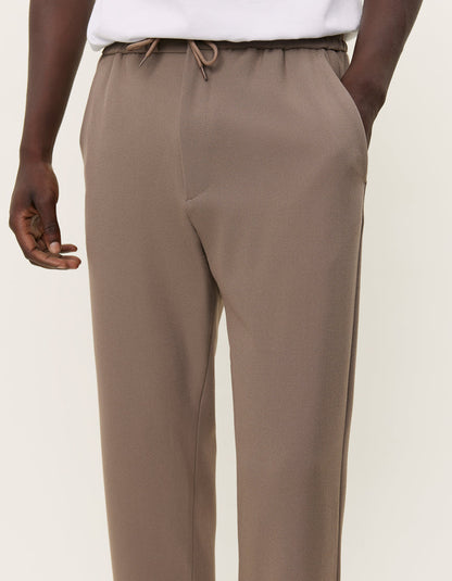 Como tapered drawstring pants bungee cord